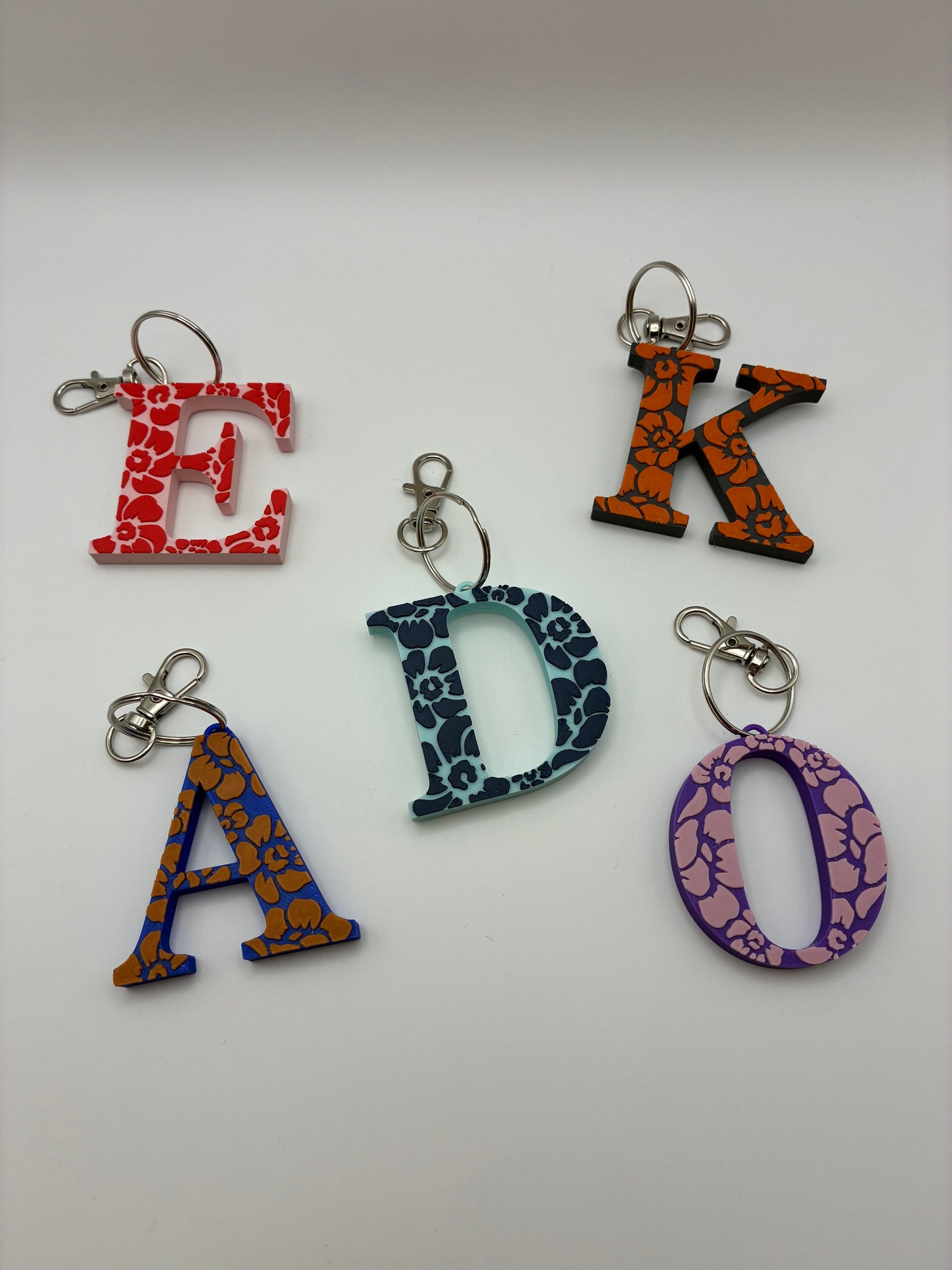 Tiki flower letter keyrings