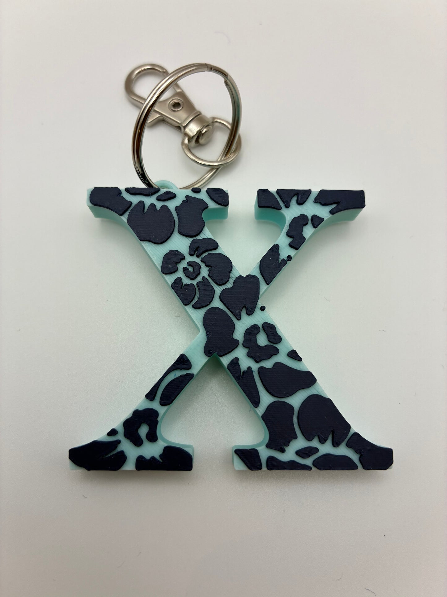 Tiki flower letter keyrings