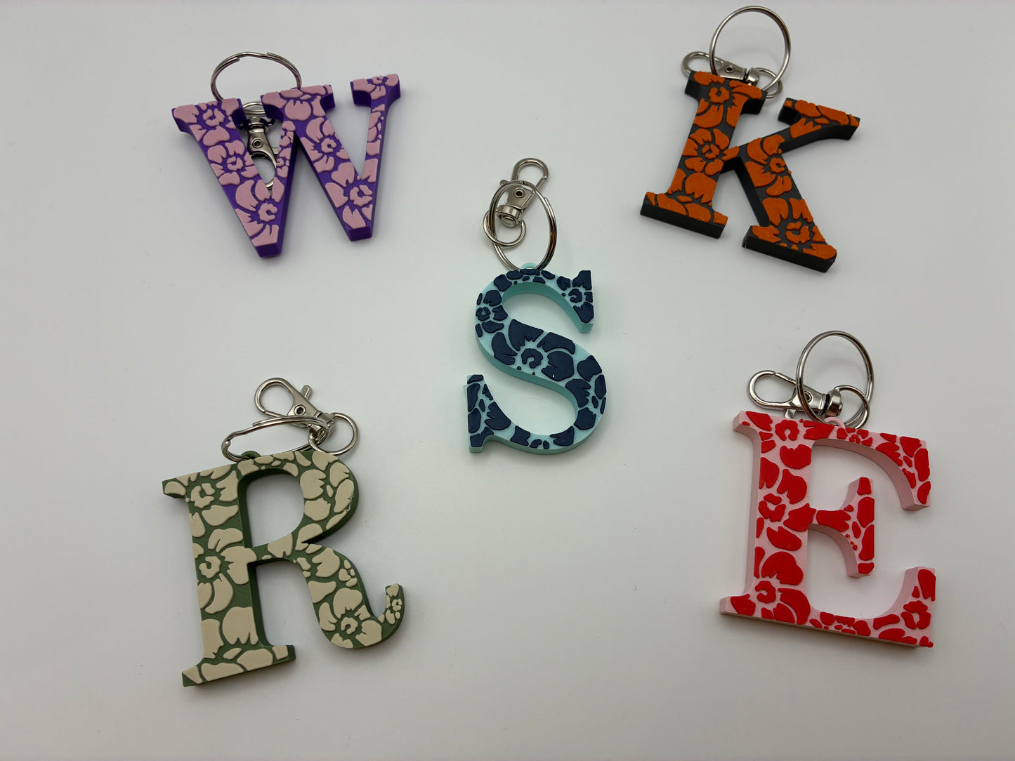 Tiki flower letter keyrings